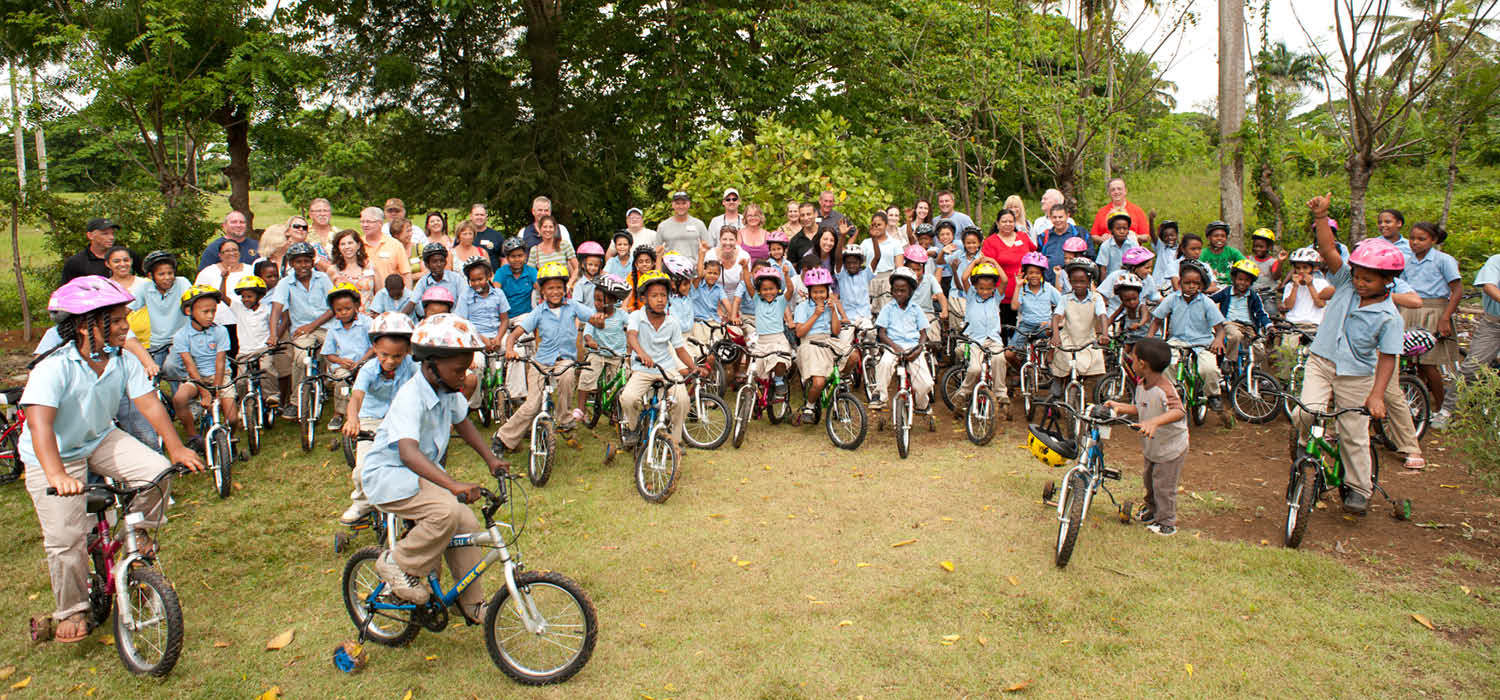 event attendees donate bikes to children